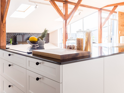 A cutting board in a nice, modern kitchen