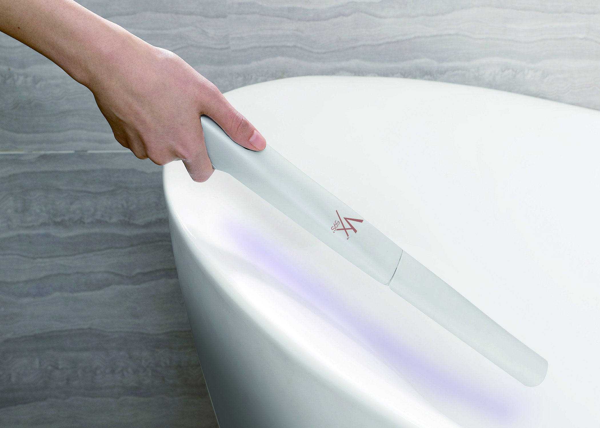 Germinator wand in use on a bathtub